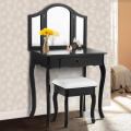 Bedroom with black dressing table with mirror and stool